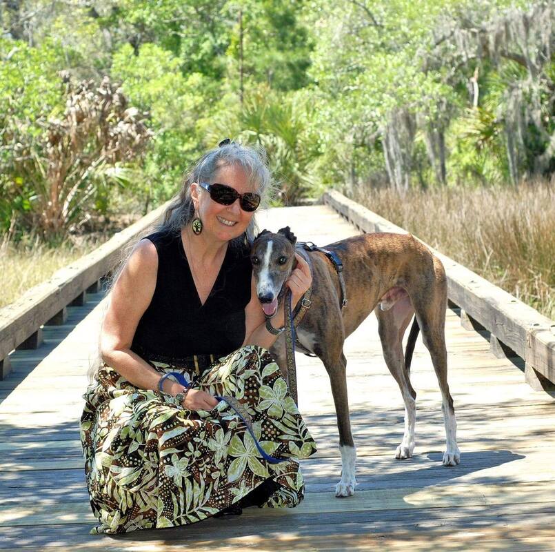A photograph of Cheryl McCarthy with her dog.